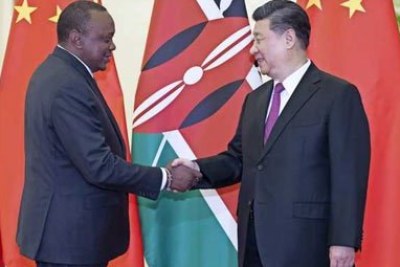 President Uhuru Kenyatta (left) greets Chinese President Xi Jinping at the Great Hall of the People in Beijing on April 25, 2019 ahead of the second Belt and Road Forum for International Cooperation.
