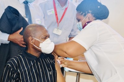 South African Minister of Health Zweli Mkhize receives the coronavirus vaccine at the Khayelitsha District Hospital, Western Cape on February 16, 2021.