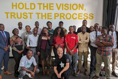 A group of participants of Open Parly, an initiative to promote a new generation of young citizen journalist poses for a photo with Magamba Network Creative Director Farai Monro & Magamba Africa Project Officer Nyasha Mukapiko kneeling in the front.