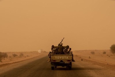 A military convoy on a counter-terrorism patrol in the Sahara Desert.